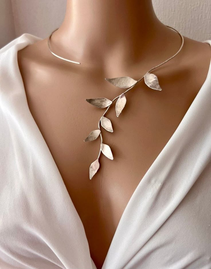 ONE-OF-A-KIND VINE NECKLACE *Made to order* This open collar statement necklace will complement both your night and daily outfits. It will make the perfect unique gift for a loved one, or for yourself! The necklace is completely handmade by me by using traditional silversmithing methods. The open end is flattened, so it won't prick clothes or skin. Due to its handmade nature of the necklace there might be slight differences to the one in the picture, but I will make it as similar as possible. MATERIAL: The necklace is made from 925 Sterling Silver *CUSTOM: Please contact me if you'd like this design in another metal (for example 14K or 18K Solid Gold) Check out the rest of my work here: ♥  Insta @stellartales ♥ Game Of Thrones Necklace, Vine Necklace, Latina Jewelry, Opal Gifts, Jewelry Making Classes, Statement Collar Necklace, Necklace Collar, Necklace Bridal, Leaf Jewelry