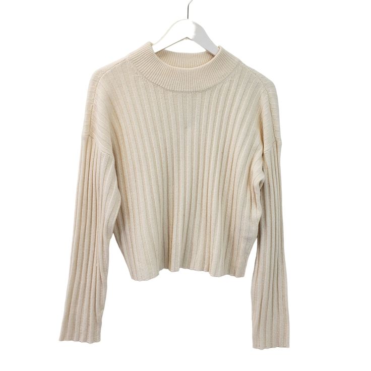 Beautiful cream color ribbed mock cropped sweater that is a great piece to wear alone or layer with a button down shirt underneath. Nice career piece or wear for a more casual day. NOTE that preloved pieces may have changed in size with wash and wear so please check approximate measurements for current size and fit.Size: Womens MApproximate Measurements Lying Flat: Bust 19.5 in Waist 19 in Length 19.5 inCondition: New With TagsAll pieces are stored in a smoke-free, pet-free environment. If flaws Ribbed Cropped Sweater For Fall Workwear, Fall Ribbed Cropped Sweater For Work, Ribbed Long Sleeve Cropped Sweater For Layering, Trendy Beige Sweater With Ribbed Collar, Solid Cropped Sweater With Ribbed Collar For Fall, Ribbed Collar Cropped Sweater For Fall, Casual White Cropped Sweater With Ribbed Neckline, Spring Ribbed Sweater For Work, Spring Cropped Sweater With Ribbed Collar