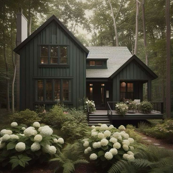 a house in the woods with white flowers