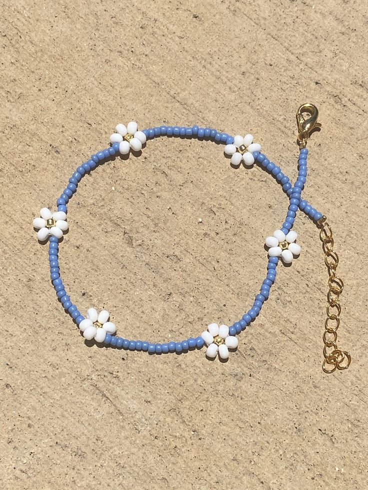 🌊 Handmade in Marina Del Rey, Southern California "Summer Daisies" Beaded Anklet is perfect for layering with other anklets, on the sandy beach, staycation at home or great to wear with any outfit. Each piece is unique as it is handmade and inspired daily. No two are alike. 🌊 Very Lightweight and comfortable 🌊 Premium quality Glass Seed Beads in size 11/0 (approx 2mm) and 13/0  (approx. 1.8mm) 🌊 Durable nylon thread or Durable monofilament cord 🌊 24kt gold plated lobster clasp  🌊 1.5" 24kt Seed Bead Shoe Anklet, Beach Anklets Diy, Blue Flower Beaded Bracelets For Beach, Adjustable Flower Beaded Bracelets For Summer, Casual Anklets With Round Beads For Vacation, Casual Round Beads Anklets For Vacation, Beaded Anklets With Round Beads For Summer, Beaded Anklets For Beach Season, Flower Shaped Beaded Bracelets For Beach In Spring