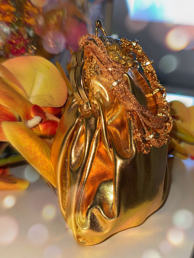 a gold purse sitting on top of a table