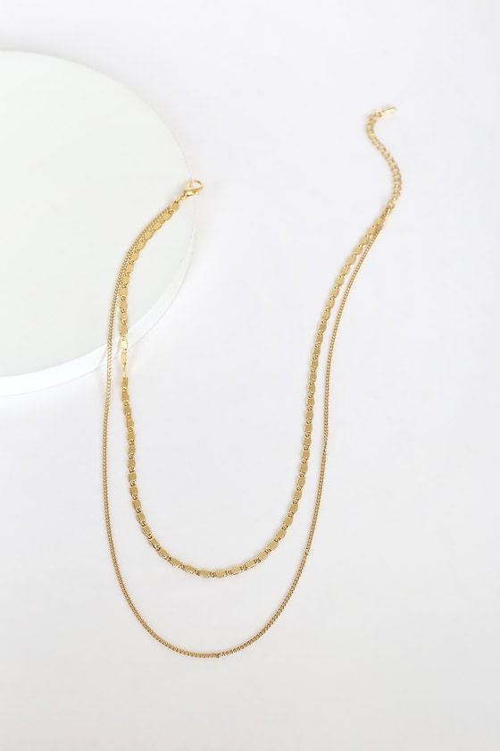 Sometimes most minimal pieces make the biggest impact! The Lulus Simple Elegance Gold Layered Necklace is ultra-trendy with its mariner-link chain and plain gold chain that layer together beautifully. Lobster clasp closure. Shortest necklace measures 14" long with a 2. 5" extender chain. Man made materials. Imported. Lulus | Simple Elegance Gold Layered Necklace. Gold Layered Chain Link Necklace, Minimalist Gold Layered Necklace With Figaro Chain, Gold Delicate Chain Link Layered Necklace, Gold Double Strand Figaro Chain Necklace, Gold Double Strand Layered Necklace With Chunky Chain, Minimalist Gold Metal Layered Necklace, Trendy Gold Layered Necklace With Figaro Chain, Minimalist Layered Gold Chain Necklace, Minimalist Multi-strand Gold Chain Layered Necklace