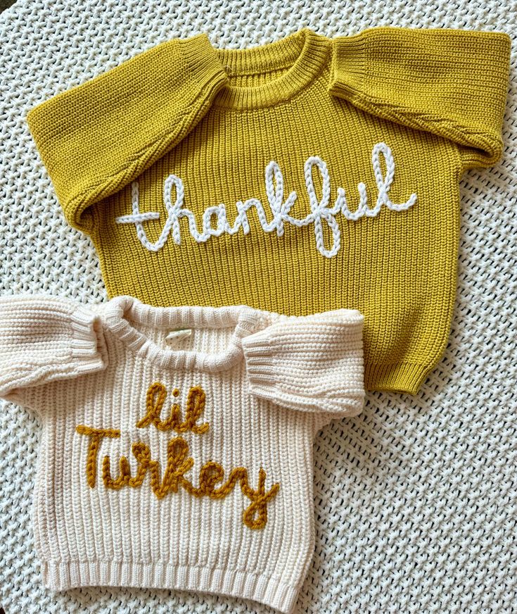 two knitted sweaters with the words, grateful and lil turkey written on them