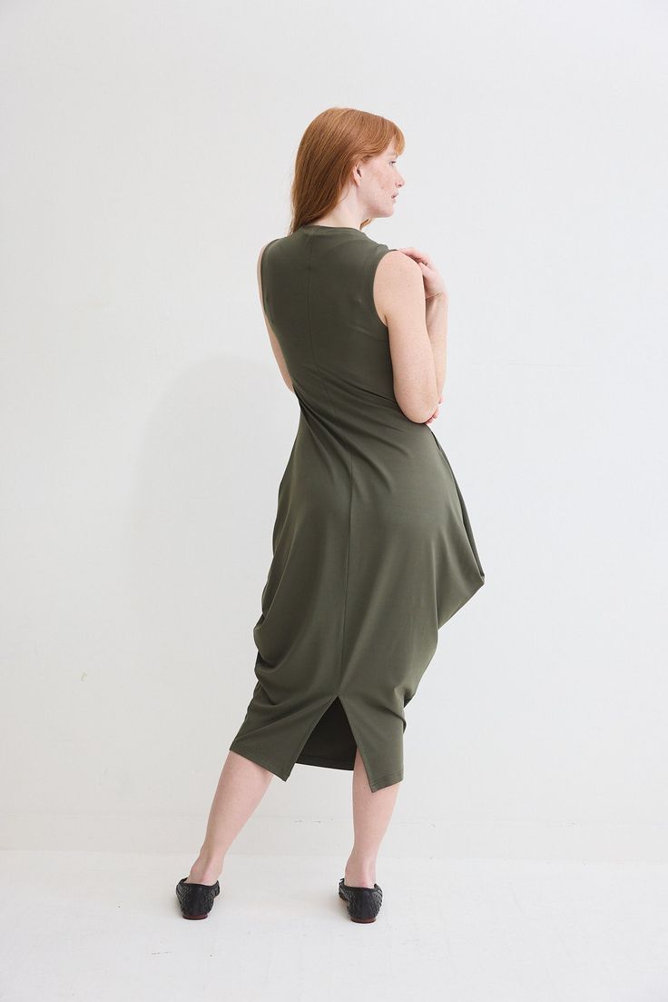 Turn heads in this chic sleeveless dress and its flattering silhouette. Pair with your favorite heels or dress down with casual sneakers Shearling Vest, Classic Blazer, Fashion Help, Dressed Down, Personal Stylist, Casual Sneakers, Wardrobe Essentials, Midi Length, Fashion Forward