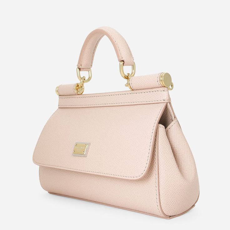 A brand icon, the practical and compact Sicily Small Handbag in Pink is perfect for carrying your essentials with you. Coming in Dauphine calfskin, it features an adjustable, detachable crossbody strap and is embellished by a logo tag with two metal plating finishes. Light Luxury Satchel Bag For Everyday, Luxury Crossbody Bag With Top Carry Handle, Light Luxury Crossbody Bag With Gold-tone Hardware, Light Luxury Travel Satchel With Detachable Strap, Designer Shoulder Bag With Detachable Strap For Everyday Luxury, Light Luxury Crossbody Bag With Adjustable Strap, High-end Everyday Luxury Crossbody Bag, Luxury Flap Bag With Adjustable Strap For Daily Use, Everyday Luxury Top Handle Bag With Gold-tone Hardware