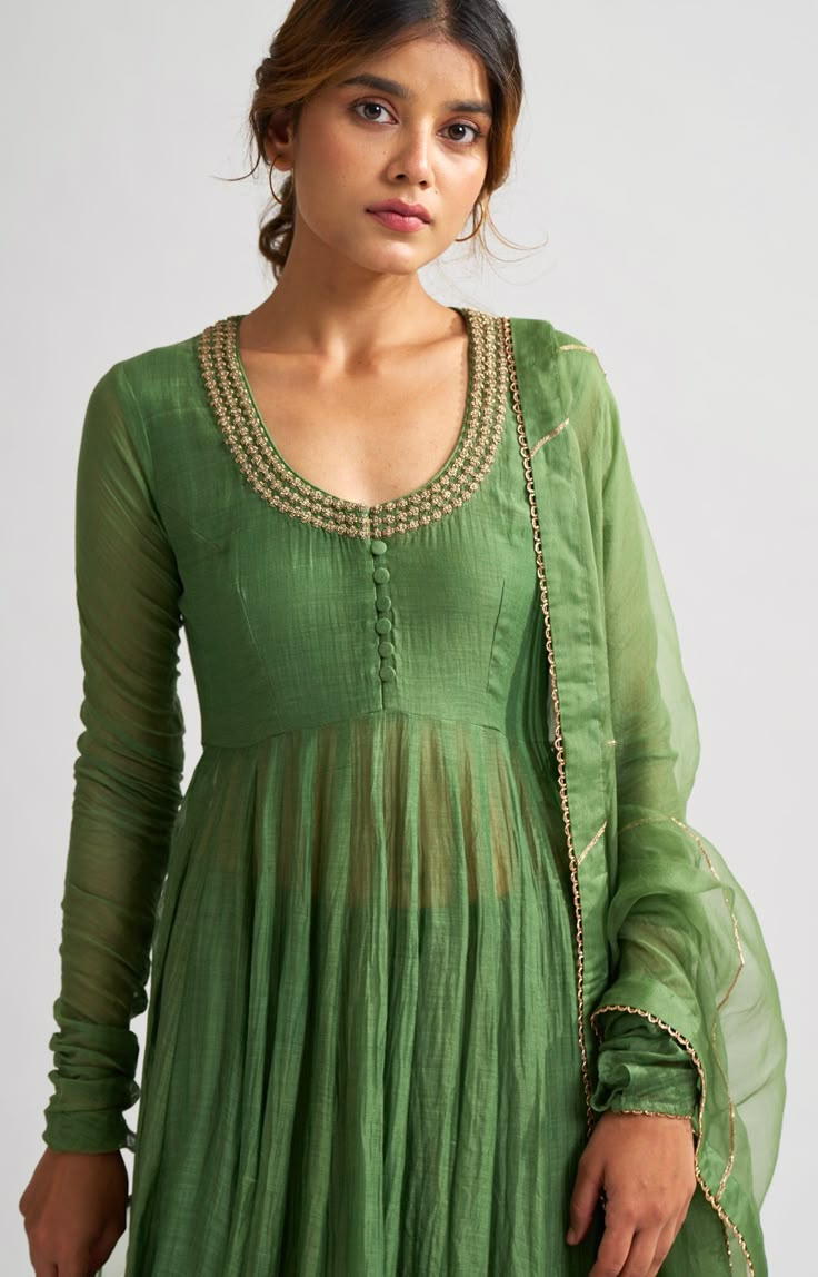 Editor's Note Chanderi Kurta Carries Grace In Its Luxurious Gheras And Myriad Kalis , Stitched Keenly Together Paired With Soft Cotton Silk Pants. The Organza Dupatta Adds A Texture Of Gossamer, Matching Splendor With Softness. Color: Green Fabric: Chanderi Anarkali , Cotton Silk Pant , and Organza Dupatta Care: Dry Clean Only About The Designer DOT is an experimental take on structural weaving. The fabrics are handwoven by our artistry weavers. Our drapes are rightly tuned with everything to do Luxury Cotton Silk Churidar With Dabka Detailing, Luxury Chanderi Anarkali Set With Handwork, Luxury Cotton Silk Churidar For Eid, Luxury Cotton Silk Elegant Anarkali Set, Luxury Cotton Silk Churidar For Diwali, Luxury Unstitched Silk Anarkali Set, Luxury Elegant Anarkali Set In Cotton Silk, Luxury Chanderi Churidar For Eid, Luxury Unstitched Mulmul Churidar