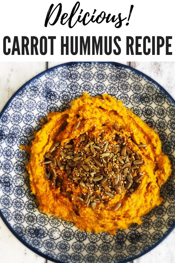 a blue and white plate topped with carrot hummus