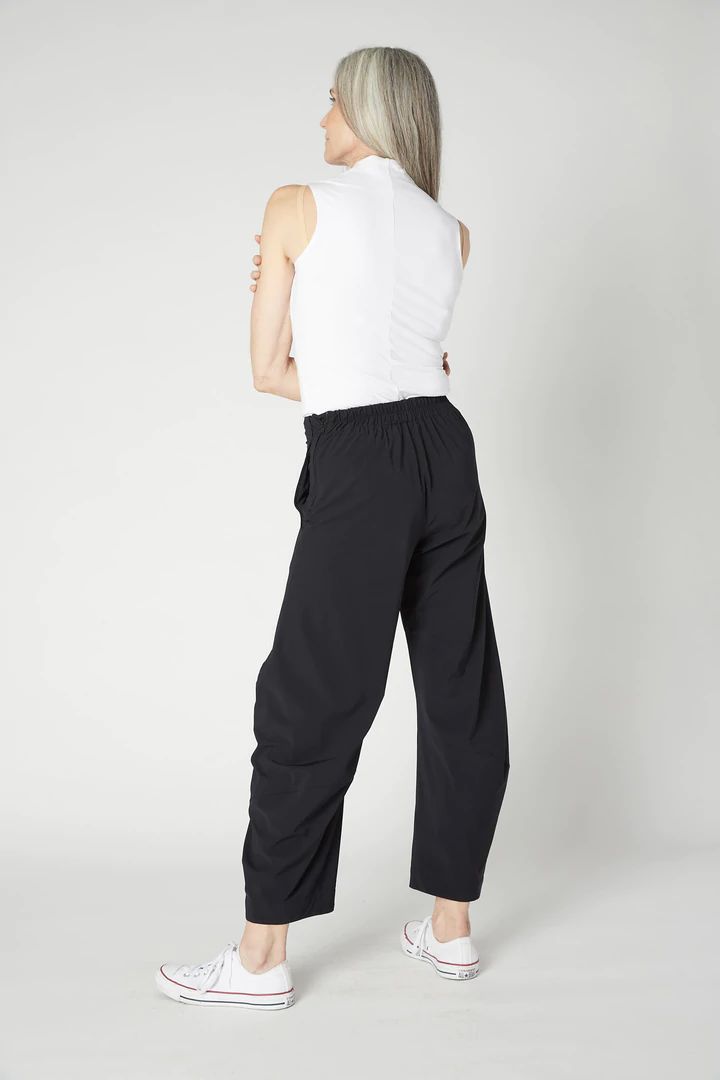 Ruti's On The Loose Work Pants are laid-back chic, uber comfortable and endlessly versatile. The ultra-flattering tapered leg design make for our favorite pant silhouette. Versatile Tapered Leg Harem Pants For Loungewear, Versatile Relaxed Fit Elastane Pants, Chic Parachute Pants With Elastic Waistband And Tapered Leg, Casual Minimal Stretch Ankle-length Pants, Casual Ankle-length Pants With Minimal Stretch, Minimal Stretch Ankle-length Casual Pants, 4-way Stretch Wide Leg Trousers With Elastic Waistband, Chic Yoga Pants With Elastic Waistband, Versatile Relaxed Fit Dress Pants With Elastic Waistband