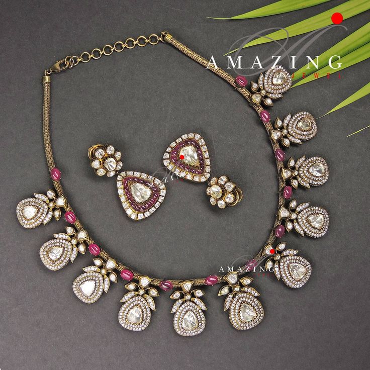 Silver Moissanite Oxidised Polki Necklace Set, Bridal Necklace Set, Wedding Jewellery, Indian Jewellery, Silver Necklace Set, Polki Necklace Set, Oxidised Necklace, Oxidised Earring Material: Silver Gemstone: Moissanite, Hydro Ruby Ovals, Swarovski Stones, Ruby Chip Stones Stone colour: Moissanite Uncut polki Primary colour: Gold (Antique Look) Size- Necklace length: 550mm Earring: 50 mm Silver Intricate, handcrafted, Pure Silver Polki Necklace Set, studded with high-quality Moissanite Polki and Diamond Cutdana Necklace For Gift, Traditional Hand Set Diamond Necklace For Wedding, Traditional Hand-set Diamond Necklace For Wedding, Traditional Silver Diamond Necklace With Single Cut Diamonds, Traditional Diamond Necklace With Single Cut Diamonds For Celebration, Traditional Kundan Bridal Necklace With Rose Cut Diamonds, Fusion Style Diamond Bridal Necklace For Reception, Wedding Temple Jewelry Diamond Necklace, Diamond Cutdana Jewelry For Anniversary