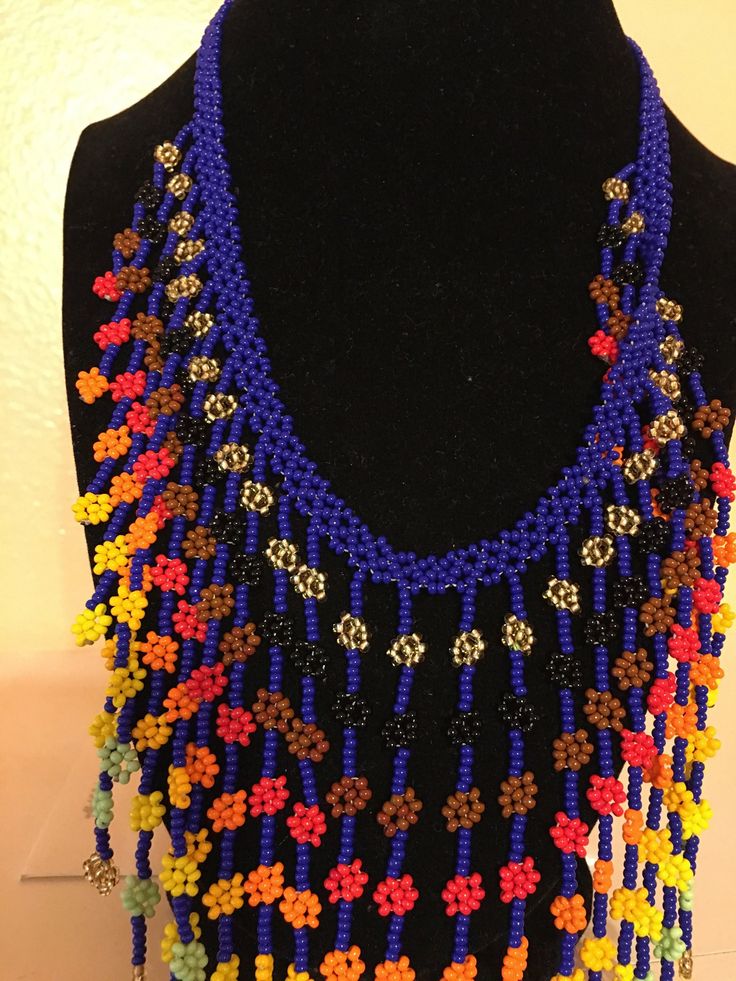 One of a kind necklace made in Colombia South America. Handmade with chaquira beads. Chaquira means life and different colours.  This type of beading is pretty intricate and it takes approx 4 hrs to make one of these necklaces. Perfect for any occasion dress up and down piece.  Neck circumference is 18 inches (45 cm) Bohemian Beaded Chain For Crafting, Handmade Hippie Blue Jewelry, Unique Multicolor Small Beads, Handmade Hippie Beaded Necklaces As Gift, Handmade Hippie Beaded Necklaces For Gifts, Handmade Hippie Beaded Necklace For Gifts, Artisan Multicolor Beaded Necklaces, Hippie Beaded Necklaces For Festivals, Festival Blue Beaded Necklaces With Colorful Beads