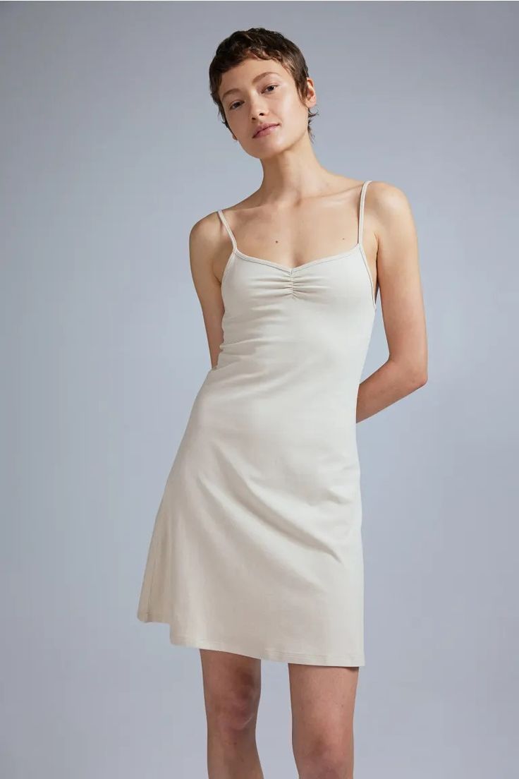 Flared-skirt Camisole Dress - Sweetheart Neckline - Sleeveless - Light beige - Ladies | H&M US 2 Fitted Sundress With Built-in Bra, Cotton Dress With Spaghetti Straps And Built-in Bra, Fitted Slip Dress With Built-in Bra For Spring, Fitted Slip Dress With Sweetheart Neckline For Spring, Mini Cotton Dress With Ruched Bodice, Fitted Cotton Suspender Dress With Spaghetti Straps, Summer Ruched Slip Dress With Sweetheart Neckline, Ruched Slip Dress With Sweetheart Neckline For Summer, Summer Slip Dress With Ruched Bodice And Sweetheart Neckline