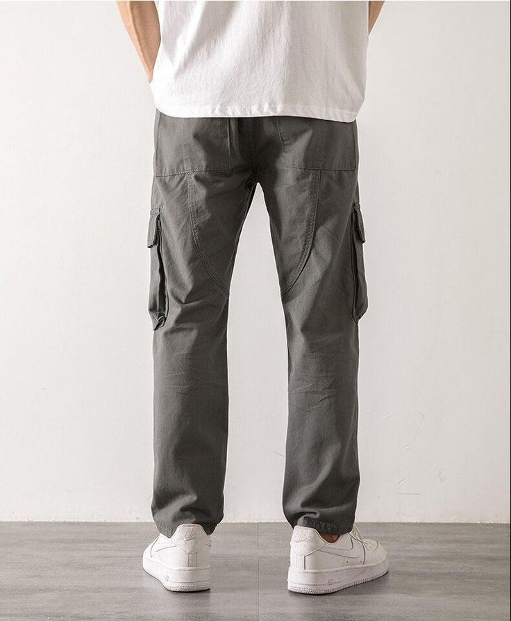 Step out in style with these straight leg cargo pants. Designed with an elasticated waistband and a functional drawstring, these pants are crafted from durable cotton. The cargo-style pockets on the leg add a touch of utilitarian chic, making them a versatile addition to any man's wardrobe. Elasticated waistband with drawstring Men's pants Cotton Cargo-style pockets on leg Straight leg Straight Leg Cargo Pants, Oversized Streetwear, Streetwear Grunge, Corsets And Bustiers, Pants Cotton, Cargo Skirt, Pantalon Cargo, Dress For Short Women, Men's Wardrobe