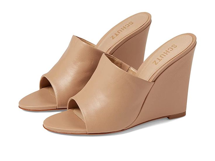 Schutz Lucy Casual - Women's Sandals : True Beige : Look exotic while flexing the elegant Schutz Lucy Casual sandals. Leather upper. Synthetic lining and leather insole. Slip-on style. Platform heel. Open almond toe. Rubber outsole. Made in Brazil. Measurements: Heel Height: 4 1 10 in Weight: 0.0282 oz Product measurements were taken using size 7, width M. Please note that measurements may vary by size. Slip-on High Heel Sandals With Removable Insole, Chic Slip-on Wedge Heel Sandals, Classic Slip-on Heels For Summer, Fitted Slip-on Mules For Summer, Summer Leather Heels With Cushioned Footbed, Elegant Beige Sandals With Leather Footbed, Spring Slip-on Heels With Leather Footbed, Slip-on Cushioned Sandals With Almond Toe, Spring Leather Wedge Heel Mules