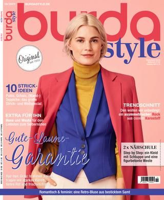 a magazine cover with a woman wearing a red jacket and yellow sweater on the front