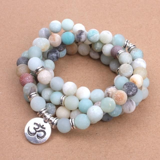 Beautifully hand-crafted Mala Beads Bracelet made of 108 Amazonite Stones with a hidden safety clasp from zinc alloy. Amazonite is known for its healing powers and bringing good luck. Known to reduce stress, and emotional issues, Amazonite is used in Energy Boosting and Chakra Balancing. Amazonite crystal therapies are primarily used to filter out stress, guard against the evil eye, and soothing energies in the home and workplace. Becoming more and more on-trend, Malas holds a special significan Om Buddha, Amazonite Bead Bracelet, Mala Beads Bracelet, Mala Bead Necklace, Gelang Manik, Buddha Pendant, Yoga Bracelet, Mala Bracelet, Natural Stone Bracelets