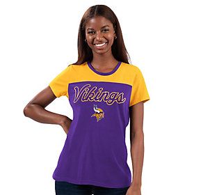 Gear up for game time while looking a little glam. This cute color-block tee features your fave team's name in a shimmery glitter print. Collegiate Purple Top For Game Day, Collegiate Purple Top For Sports Events, Purple Collegiate Tops For Sports Events, Varsity Style Team-colored Tops For Fans, Purple Fan Gear Tops With Team Name, Purple Tops With Team Name For Fan Gear, Purple Letter Print Top For Sports Fans, Purple Tops With Letter Print For Fan Gear, Purple Letter Print Tops For Fan Gear