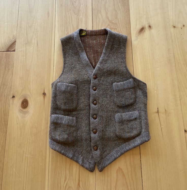 "1910s brown wool waistcoat. Small seam wear on the bottom and a visible (not award winning) repair on the back. Has some nibbles and signs of wear but in very wearable vintage condition.  Shoulder: 11.5\" Chest : 32\" Length : 21\"" Brown Wool Sweater Vest For Workwear, Wool Vest With Pockets For Tailoring, Vintage Workwear Vest With Pockets, Vintage Workwear Vest Outerwear, Brown Wool Vest For Workwear, Vintage Vest With Pockets For Work, Brown Wool Vest For Work, Brown Buttoned Vest For Winter, Tailored Brown Vest With Pockets