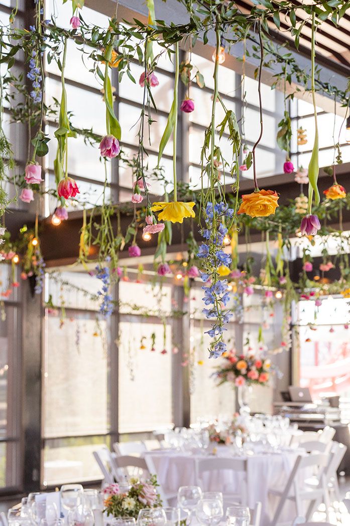 Hanging Spring Floral Installation from Industrial Beams at The Bridge Building Garden Wedding Ideas Indoor, Hanging Flowers From Trees Wedding, Hanging Flowers Pergola, Hanging Flowers At Wedding, Flowers Hung From Ceiling, Hanging Plants Wedding Decor, Wedding Flowers From Ceiling, Indoor Wedding Flowers, Hanging Flower Arch