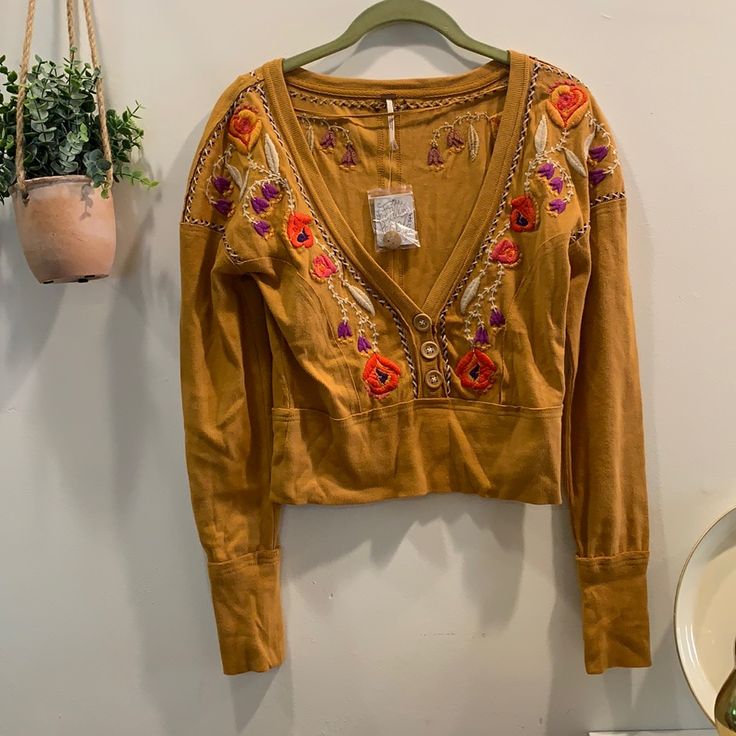 Excellent Condition Top From Free People. Can Be Dressed Up Or Down. Crop Top That Would Look Cute With Oversized Pants. Open To Offers And No Trades Hippie Floral Embroidered Tops For Fall, Orange Embroidered V-neck Top, Embroidered Orange V-neck Tops, Long Sleeve Orange Top With Floral Embroidery, Orange Floral Embroidered Long Sleeve Top, Orange Bohemian Top With Floral Embroidery, Yellow Embroidered Tops For Fall, Hippie Embroidered Tops For Fall, Embroidered Hippie Tops For Fall