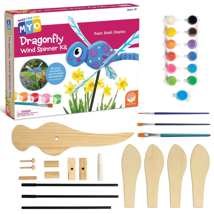 the kit includes paint, wooden spoons, markers, and glue to make a dragonfly wind spinner