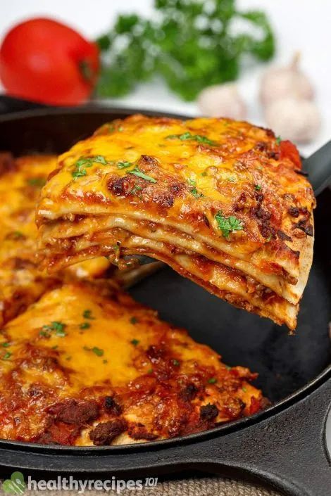 a pan filled with lasagna covered in cheese