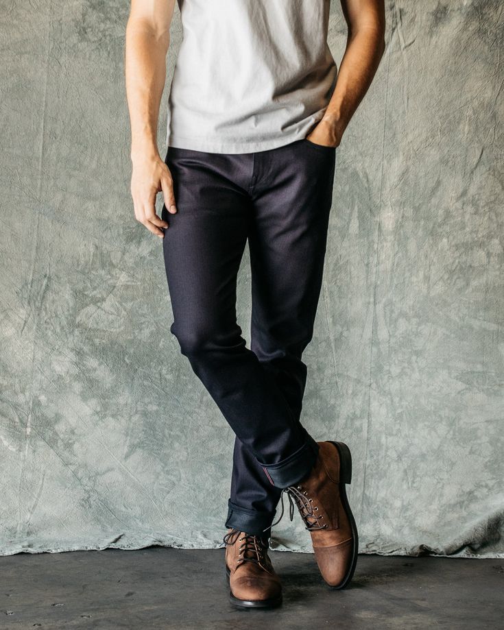 Slim Tapered Fit (Skinny fit and Slim fit are also available) Indigo Black, Raw 10.5 oz What is denim weights? 96% COTTON/4% POLYURETHANE 4-Way stretch selvedge denim Black Warp/Blue Weft Made in USA Model is 6'2" and wearing a size 32. Our premium denim is inspired by the classic vintage blue jean. Our Premium Japanese 4-Way Stretch Selvedge denim story starts in Japan where our fabric is developed at one of the oldest denim mills. We blend a unique 4 way stretch material with selvedge denim to Fitted Jeans With Contrast Stitching, Fitted Rigid Denim Jeans, Classic Jeans With Contrast Stitching And Tapered Leg, Fall Jeans With Contrast Stitching In Rigid Denim, Standard Cut Leg Denim Jeans, Everyday Rigid Denim Jeans With Standard Cut Leg, Classic Jeans With Contrast Stitching For Streetwear, Classic Fitted Jeans With Contrast Stitching, Fall Rigid Denim Jeans With Contrast Stitching