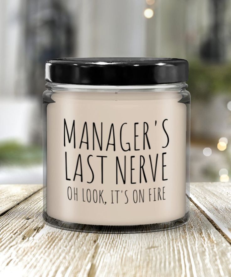 a glass jar that says manager's last neve oh look, it's on fire