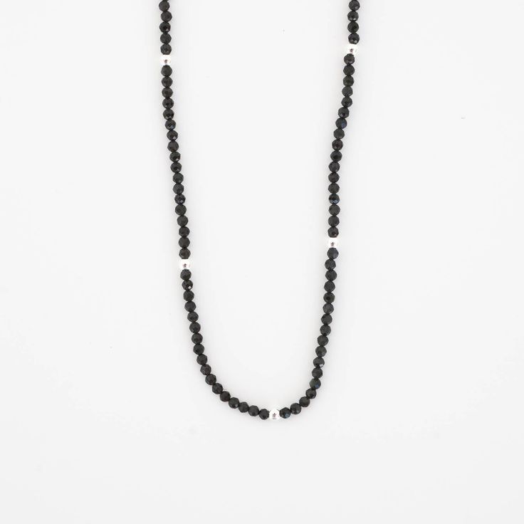 This beautiful Obsidian Beaded Necklace is edgy. elegant, and eye-catching, making it perfect for wearing by itself or layered with a simple chain necklace. The strand of pearls is punctuated with your choice of gold or silver beads for added interest. Note: We reinforce the necklace’s center silk cord with hidden knots—if your necklace breaks, most of the beads will remain intact and unaffected. For maximum life, we recommend you do not wear this necklace in water or during any rigorous activit Elegant Gemstone Beads Necklaces For Layering, Minimalist Tiny Beaded Necklaces For Layering, Single Strand Necklaces With Round Beads For Layering, Adjustable Minimalist Pearl Necklace With Beaded Chain, Everyday Single Strand Crystal Necklace With Round Beads, Minimalist Pearl Necklace With Beaded Chain, Minimalist Everyday Pearl Necklace With Beaded Chain, Everyday Minimalist Pearl Necklace With Beaded Chain, Modern Everyday Pearl Chain Necklace