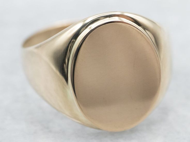 "This unisex signet ring has a modest profile on the hand and is completely un-decorated. These features make it versatile, an easy gift to give, and an easy ring to wear day-to-day.  Market Square Jewelers works with one of the finest hand engravers in the northeast. With over 30 years of experience, our engraver hand carves lettering, monograms, crests, or patterns in period-specific styles. Choose from our many monogram options shown in the listing or contact us directly with your own crest, monogram, or for additional information, and pricing! Metal: 10K Yellow Gold Width of Band: 15.7 mm Height off Finger: 2.3 mm Ring Size: 9.75 Marks: \"10K\" Stamped on the inside band To view a video of this piece check out the link below: https://vimeo.com/810551888 SKU #: A22006 Each piece has bee Market Square, Gold Statement Ring, Gold Signet Ring, Gold Gift, Gold Pattern, Jewelry Companies, Easy Gifts, Unique Engagement Rings, Signet Ring