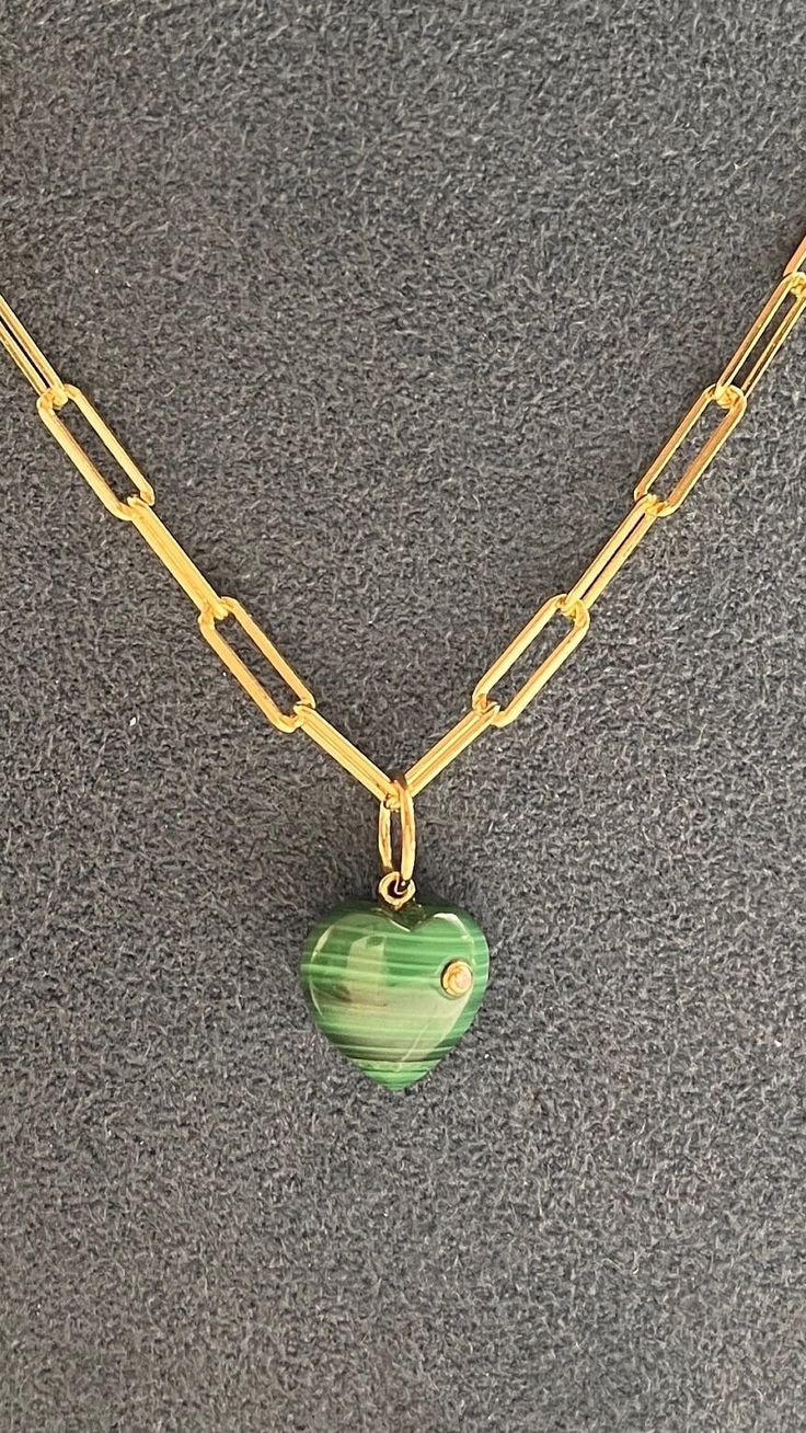 3/4 inch diamond/malachite disc charm  Celebrity style One inch - Not too big , not too small perfect with chains and layers Sterling with gold plate Bring in good karma and prosperity into your life with this Malachite Heart Pendant. This pendant features diamonds set in sterling with 14KT Yellow Gold. Emerald Jewelry With Heart Charm As Gift, Fine Jewelry Green Heart Jewelry, Green 14k Gold Heart Jewelry, Green Heart Charm Jewelry For May Birthstone, Luxury Green Necklace With Heart Charm, Green Heart Charm Jewelry, Green Heart Pendant Necklace With Charm, Green Heart Charm Round Jewelry, Green Heart Charm Pendant Necklace