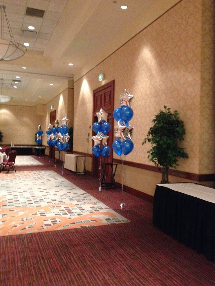 an empty room with balloons and decorations on the floor