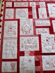 a red and white quilted christmas themed table runner