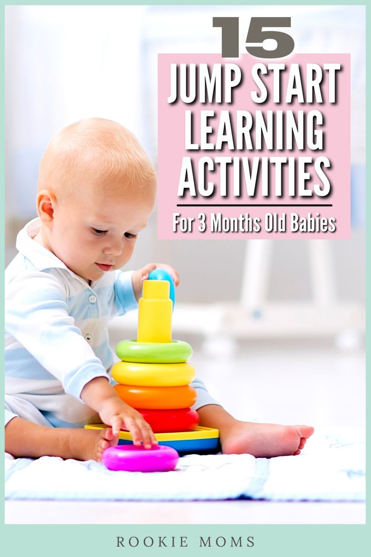 a baby playing with a stacking toy in front of the words, 11 month old learning