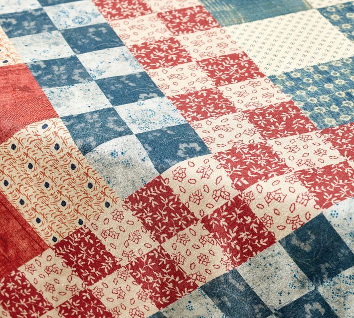 a red, white and blue patchwork quilt