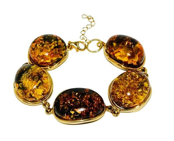 Awesome bracelet handcrafted of sterling silver covered 14ct. gold and natural Baltic amber.Five large, oval, green amber stones fitted in gold setting.This luxury jewellery suitable for everyday and evening wear.Amber stone created by nature over 25 millions years ego, amber attracts good luck, balances emotions, dissolves negative energy. Care Instructions: To maintain your jewellery, wipe gently with a cotton cloth that is soft and clean. Do not soak in water. Avoid contact with soaps, deterg Gold Armband, Luxury Jewellery, Natural Amber, Amber Stone, Amber Jewelry, Baltic Amber, Negative Energy, Chain Link Bracelet, Luxury Jewelry