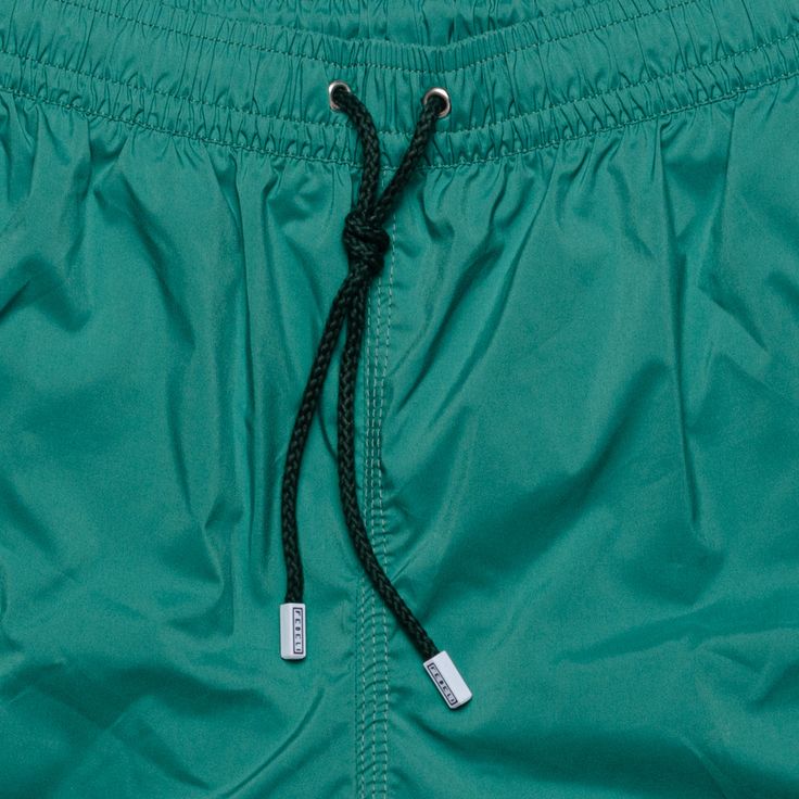 NEW Size: 3XL Emerald Green Color Made of 100% recycled polyester, quick-drying microfibre Net lining Elastic waistline with drawstring Pockets in the side seam Back pocket Not Included carabiner in whale shape Made in Italy Cut from a lightweight RECYCLED microfibre cloth - one that is quick to dry and ethereally soft to the touch - and made under the auspices of traditional Italian craftsmanship, the Fedeli Madeira swim trunks are a true summer staple. Classic in cut and made without compromis Summer Staples, Swim Trunks, Emerald Green, Swim Shorts, Green Colors, Emerald, Swimming, Green, Clothes