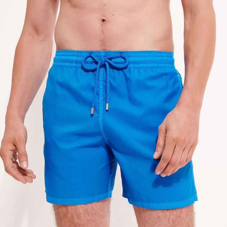 Choose a lightweight style with the Mahina men's swimsuit in plain eco-friendly material. Its fabric made from recycled plastic bottles is both responsible and ultra-lightweight. These classic men swim trunks with an elasticated waistband can be folded up into the back pocket for easy storage and transport.Ultra-light fabric packable men swimwear into the zipped back pocket to become a pouch with a Vilebrequin rubber labelElastic waistband with drawstring and Zamac tips engraved VilebrequinMen s Solid Color Swimwear With Upf 50+ For Water Sports, Solid Nylon Swim Trunks For Beach Season, Solid Swim Trunks With Upf 50+ For Pool, Blue Short Outdoor Swimwear, Blue Short Swimwear For Outdoor, Blue Fitted Swimwear For Outdoor, Fitted Blue Swimwear For Outdoor, Blue Short Length Swimwear For Outdoor, Solid Color Beachwear Swim Trunks For Water Sports