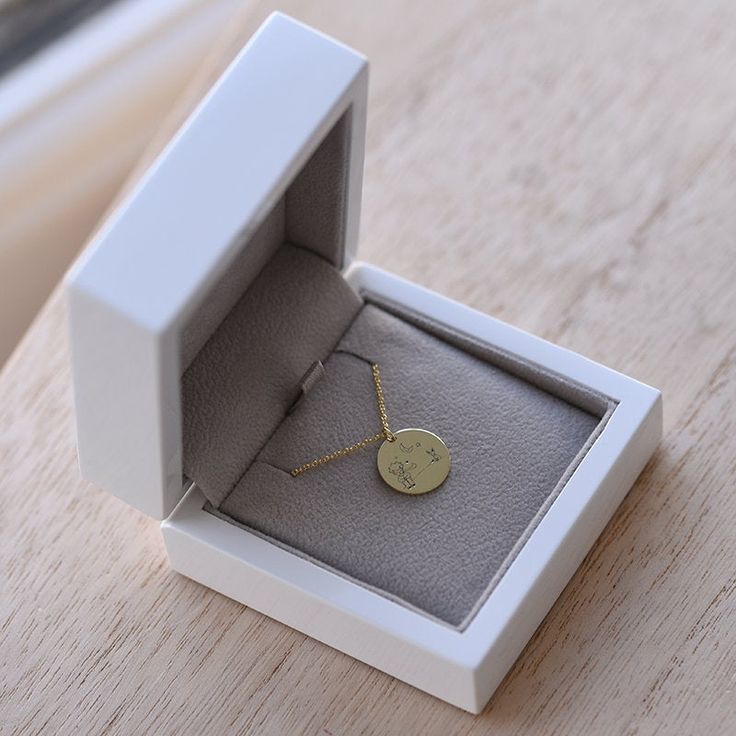 Inspired by the modern classic fable, The Little Prince, this 14k Rose, Yellow or White Gold necklace, with a choice of necklace length of 16, 18 and 20 inches is instantly recognizable as a gentle reminder that the best things in life are still the simplest, especially the love of others ❤. Not only does this enchanting necklace project love, the back of the pendant can also be engraved to your choosing, making it a truly personal keepsake for the special person in your life. ❤ Hand Made with l Yellow Gold Name Necklace With Round Pendant For Gift, Elegant Laser Engraved Necklaces For Mother's Day, Modern Engraved Necklaces For Gifts, Modern Engraved Necklace For Gift, 14k Gold Round Pendant Name Necklace, Minimalist 14k Gold Necklace For Anniversary, Modern Yellow Gold Name Necklace For Gift, Modern Yellow Gold Name Necklace As Gift, Meaningful Engraved Yellow Gold Necklace