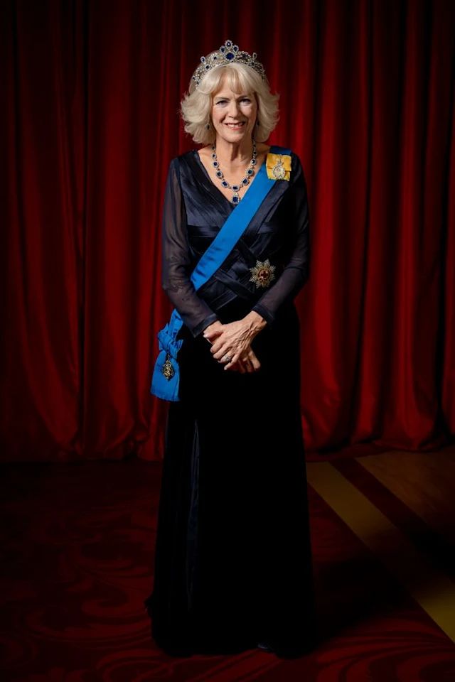 an older woman wearing a tiara standing in front of a red curtain with her hands on her hips