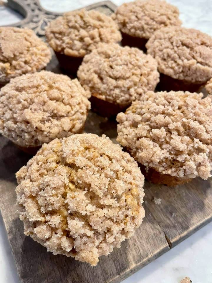 several muffins are sitting on a cutting board