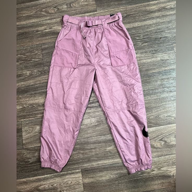 Nike Women's Woven Swoosh Pink / Purple Cargo Pants With Belt New With Tags Light Weight Y2k Trendy Parachute Pants Wind Breaker Type Material Very 90s Purple High Waist Pants For Streetwear, Purple Cotton Cargo Pants, High Waist Purple Pants For Streetwear, Pink Cotton Utility Parachute Pants, Purple Streetwear Pants With Pockets, Streetwear Purple Pants With Pockets, Casual Lavender Pants With Pockets, Purple Cargo Pants For Streetwear, Purple High Waist Cargo Pants