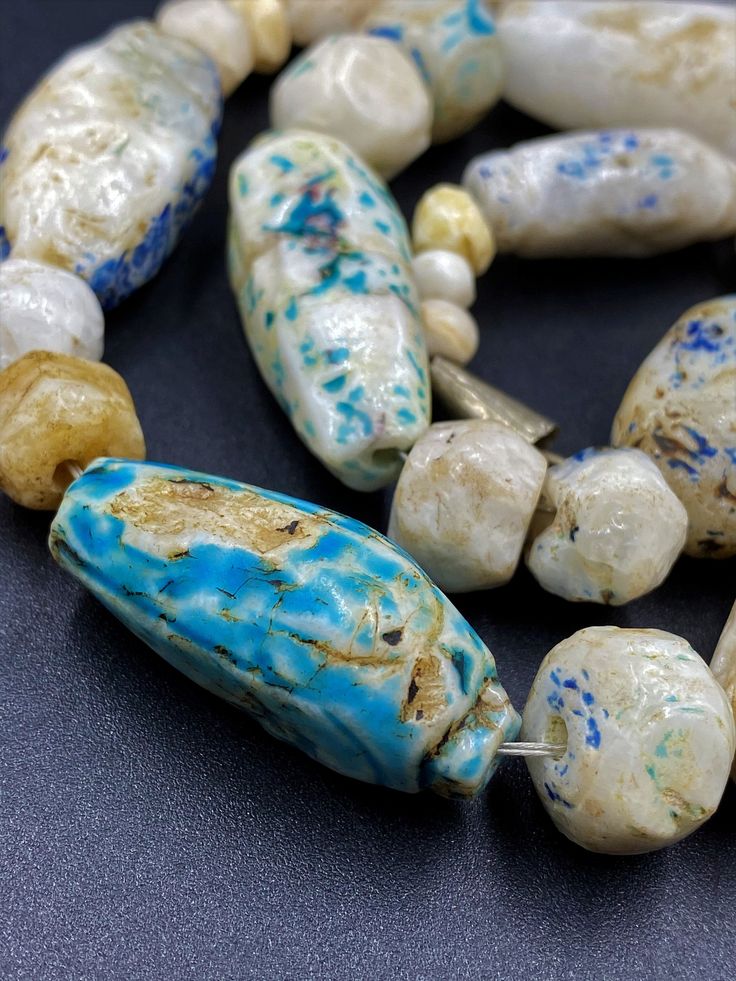 The Rare and Unique Beads necklace of Ancient Rough Rock Crystals Almost every Bead is Beautifully Carved and Beautifully painted with Blue color Rare and unique Item for collection Fast and Free shipping service Artisan Gemstone Beads For Jewelry Making, Artisan Beaded Necklace With Oval Spacer Beads, Unique Round Gemstone Beads, Artisan Beaded Necklace With Gemstone Beads, Unique Spacer Beads For Jewelry Making, Unique Gemstone Beads, Artisan Beaded Necklaces With Spacer Beads For Jewelry Making, Carnelian Beads, Agate Bracelet