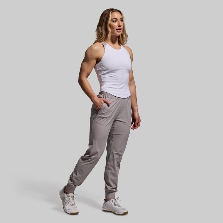 It doesn’t get more lightweight than this. Made from an ultra-breathable fabric, our Performance Jogger boasts distraction-free comfort that’s made for warm days in the gym, on the track, or around town. Added stretch provides maximum range of motion for nearly any movement. With the ideal balance of comfort, function, and utility, these women's grey jogger sweatpants will quickly become your go-to for summer training days. Sporty Activewear With 4-way Stretch And Breathable Fabric, Functional Activewear With Light Support And Breathable Fabric, Breathable Compressive Casual Activewear, Sporty 4-way Stretch Activewear For Gym, Sporty Gym Activewear With 4-way Stretch, Gray Sporty Activewear In Breathable Fabric, Gray Sporty Activewear With 4-way Stretch, Sporty Gray Activewear With 4-way Stretch, Sporty Gray 4-way Stretch Activewear