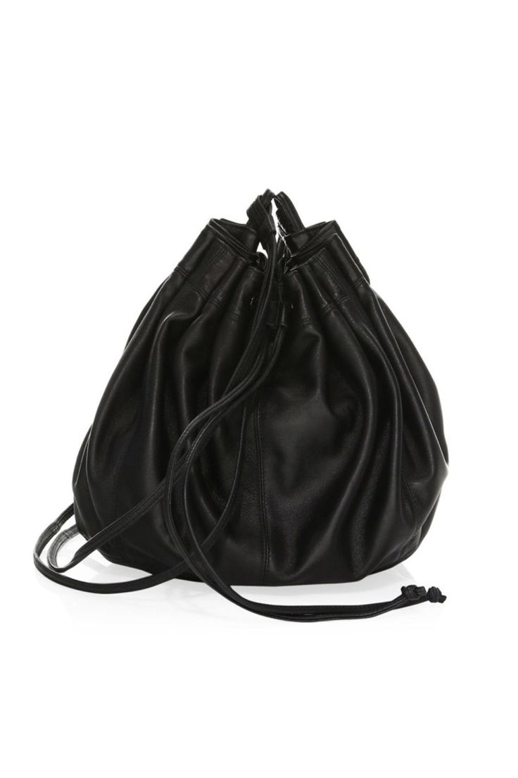 The Dex nappa bag by ELIZABETH AND JAMES is an enduring bucket bag with unique pull tie closure, shoulder strap, drawstring closure, interior zip pocket and open pocket.COLORBlackCOMPOSITIONLeatherDIMENSIONS 10 x 18 x 9 in (H x W x L) Leather Lined Bucket Bag For Shopping, Leather-lined Bucket Bag For Shopping, Travel Hobo Bag In Soft Leather Bucket Shape, Chic Bucket Drawstring Bag For Everyday Use, Black Soft Leather Bucket Shoulder Bag, Chic Travel Bucket Drawstring Bag, Soft Leather Evening Bucket Bag, Travel Soft Leather Crossbody Bucket Bag, Leather Bucket Backpack With Detachable Strap