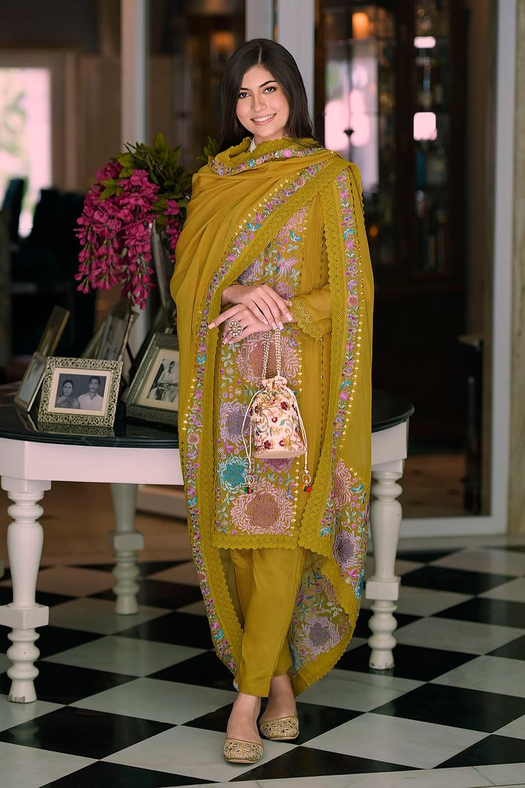 This Suit is a suitable amalgamation of style and grace that is required from ethnic wear. The dress is ideal for any formal or informal gathering. Crafted with the utmost care, our plazzo suits are made from high-quality fabrics that offer comfort and breathability, allowing you to move effortlessly. The highlight of our salwar suit, is meticulously designed to enhance your beauty. It comes in a range of stunning styles, catering to diverse occasions and preferences. Chest Size: Medium: 38 Inches Large: 40 Inches X-Large: 42 Inches XX-Large: 44 Inches XXX-Large: 46 Inches FABRIC : Top: Organza With Fancy Embroidery Work With Khatali Work Bottom – Heavy silk Duppta – Organza With Embroidery Work Gpo Lac NOTE: COLOR MAY SLIGHTLY VARY FROM THE PICTURE NOTE: This Suit is stitched in size 38, Unstitched Bollywood Suits With Dupatta, Festive Bollywood Suit With Dupatta, Festive Suits With Dupatta For Eid, Traditional Festive Georgette Suits, Bollywood Style Suits With Resham Embroidery For Eid, Eid Festive Semi-stitched Suits, Festive Georgette Suits With Resham Embroidery, Semi-stitched Suits For Eid Festival, Traditional Semi-stitched Suit With Dupatta