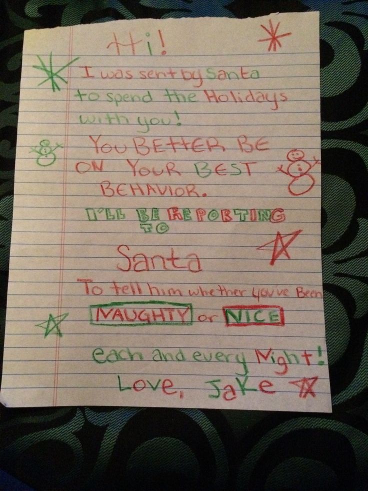 a handwritten christmas wish list written in red, green and blue on lined paper