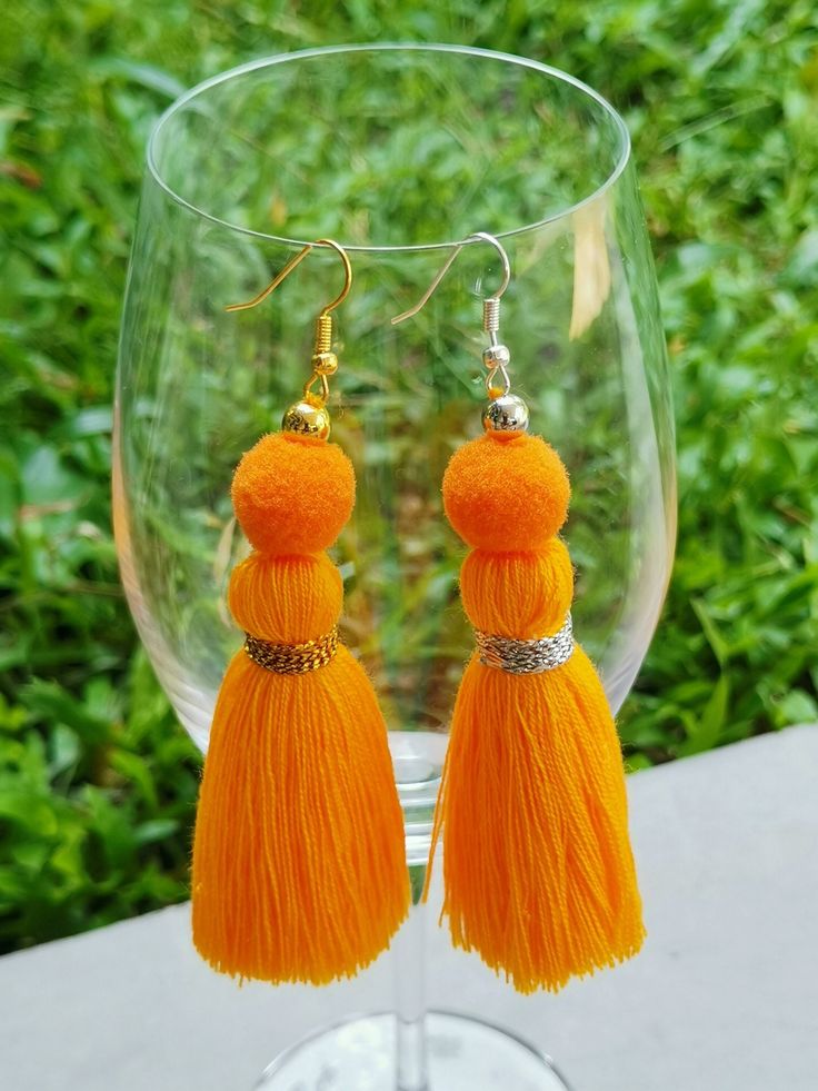 Tassel earrings in a variety of colors make a great gift! a perfect statement earring for those with sensitive ears! Weight: 0.08 ounce each Droplength: 4 Inches from the top of the earwire. These are handmade products. Made from threads and breads. lightweight. Colors may vary slightly due to screen settings. Orange Tassel Dangle Earrings, Adjustable Orange Tassel Earrings, Bohemian Orange Fringe Earrings, Orange Beaded Tassel Earrings As Gift, Orange Fringe Earrings As A Gift, Orange Fringe Earrings As Gift, Orange Fringe Tassel Earrings For Gift, Orange Tassel Drop Earrings As Gift, Orange Tassel Drop Earrings