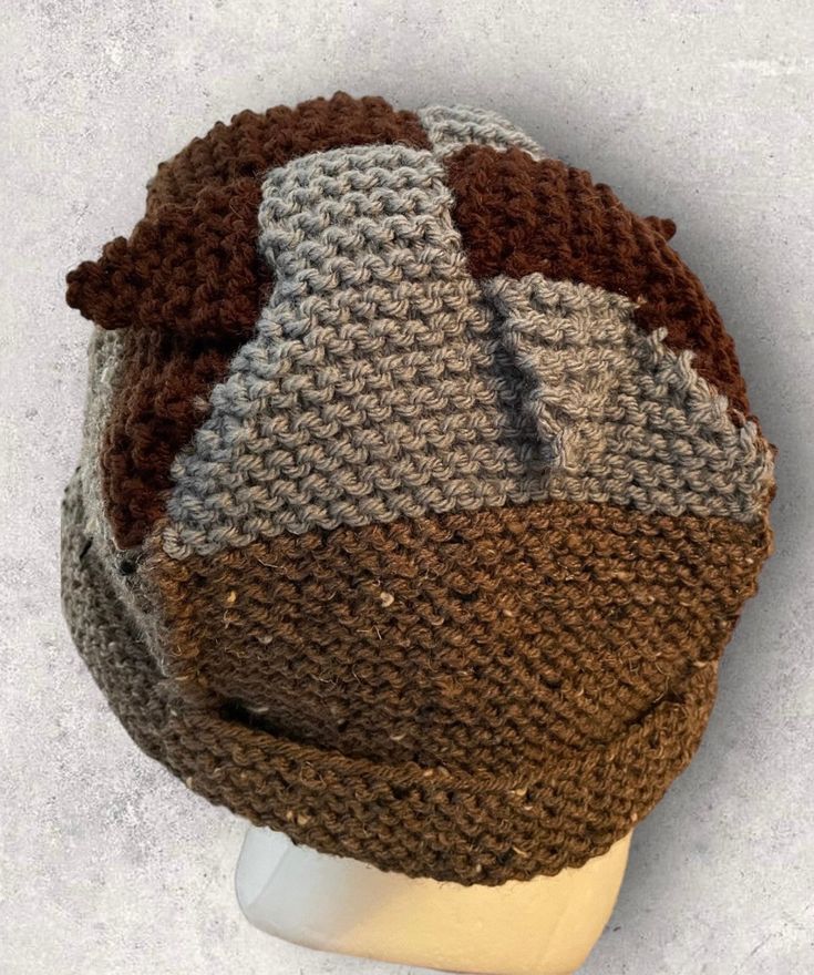 "Woven top flap hat with interlocking panels in gray and brown with barley colored body. Bucket hat style. Loose fit for most. Panel construction to show seams.  Measures 12.5\" wide by 7.5\" tall with brim folded. Made with wool and acrylic blend yarn. Can be washed in warm water, lay flat to dry. Thanks for checking out this item!" Brown Crochet Hat With Curved Brim For Outdoor, Outdoor Brown Crochet Hat With Curved Brim, Brown Curved Brim Crochet Hat For Outdoor, Brimmed Brown Beanie For Outdoor, Brown Beanie For Outdoor Wear, Brown Outdoor Beanie, Brown Hat Bands For Winter, One Size Fits Most, Adjustable Brown Crochet Hat For Outdoors, Adjustable Brown Crochet Outdoor Hat