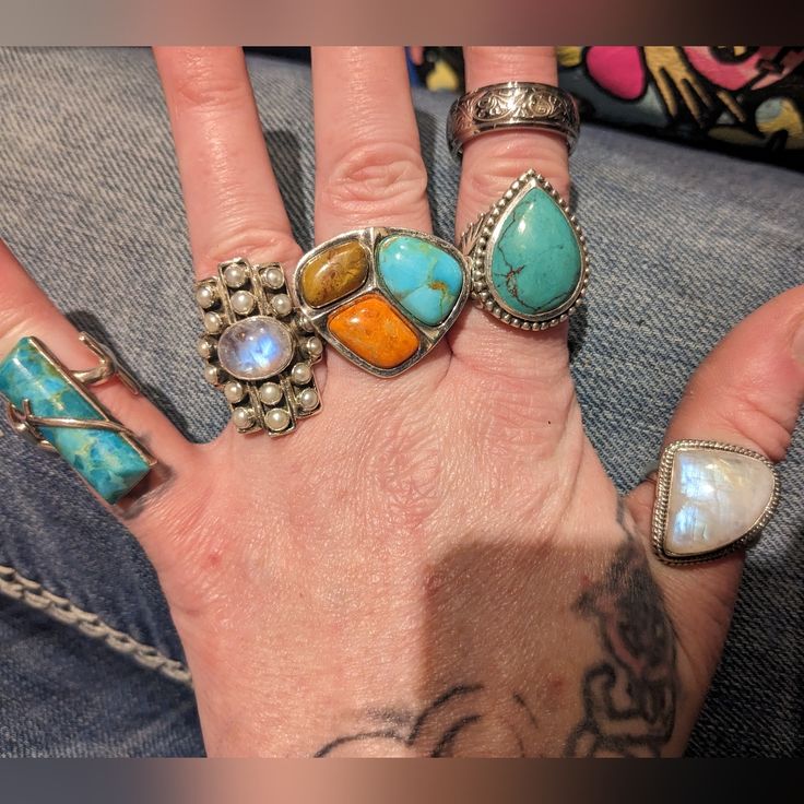 I Have 10 Antique Solid 925 Sterling And Turquoise Rings, If You Would Like Them All, Or Just A Couple Or Just One Let Me Know They All Have Theyr Boxes And The Stones Are Real, Except The Thick One With The Red Stones In The Flowers I'm Not Sure About That One, There Is The One Moonstone, Also I Have Sets Of Rings Earrings Necklaces And Bracelets... , I Have Tons Of Turquoise And 935 Sterling Jewelry Bracelets Necklaces Earrings None Are Plated. If You Would Like To Look At Other Items Message Me On Here. Smoke And Pet Free Home Make An Offer Only If Its Realistic And Reasonable, Please Dont Sent Rediculous Low Ball Offes You Will Be Ignored. Unique Turquoise Gemstone Ring, Round Turquoise Ring With Gemstone Accents, Artisan Open Turquoise Ring, Turquoise Spiritual Gemstones In Sterling Silver, Spiritual Turquoise Gemstones In Sterling Silver, Fusion Style Turquoise Sterling Silver Jewelry, Fine Gemstones For Jewelry Making, Bohemian Turquoise Gemstones In Sterling Silver, Southwestern Sterling Silver Gemstone Jewelry