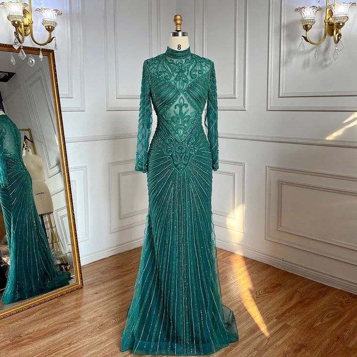 Emerald Elegance: These dresses embody the opulence and sophistication associated with Dubai-inspired fashion, featuring an elegant emerald green hue. Luxury Heavy Beading: The heavy beadwork adds a sense of extravagance and glamour to your attire, making a striking statement. Versatile Occasions: Ideal for a variety of formal events, including weddings, Muslim Arabic events, and champagne-themed formal occasions. 2024 Fashion: Reflecting the latest 2024 fashion trends, these dresses keep you at Elegant Fitted Green Ball Gown, Elegant Green Ball Gown With Sweep Train, Elegant Green Ball Gown, Fitted Green Ball Gown For Gala, Elegant Ball Gown Wedding Dress For Reception, Elegant Green Wedding Ball Gown, Embellished Green Ball Gown For Gala, Green Embellished Fitted Ball Gown, Fitted Embellished Green Ball Gown